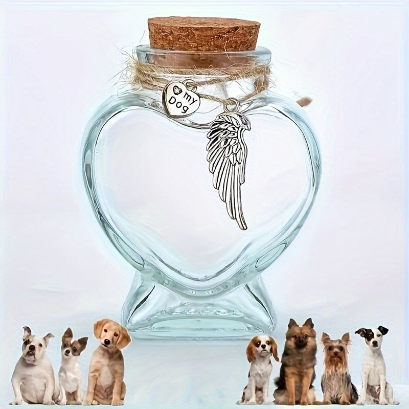 Heart-shaped glass bottle with angel wing charm and 'My Dog' tag, surrounded by small dog figurines.